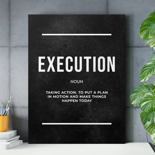 Motivační obraz Execution - Definice nad pracovním stolem.