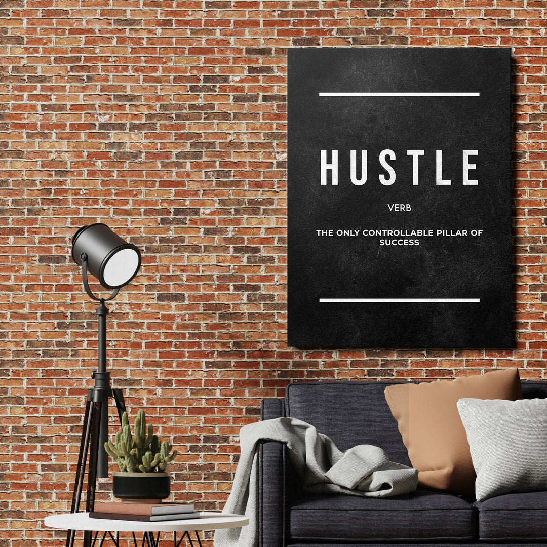Motivační obraz Hustle - Tabulová definice na cihlové zdi.