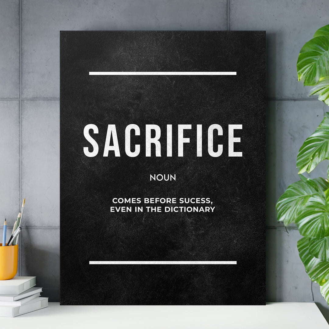 Motivační obraz Sacrifice - Definice nad pracovním stolem.
