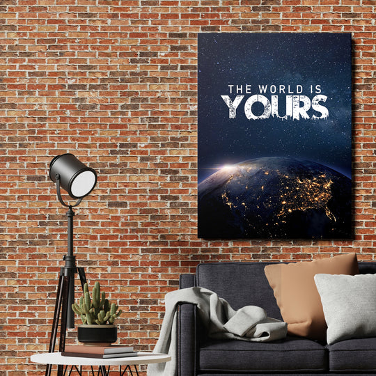 Motivační obraz - The World Is Yours na cihlové zdi.