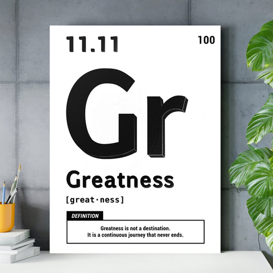 Motivační obraz Greatness - Bílá definice nad pracovním stolem.