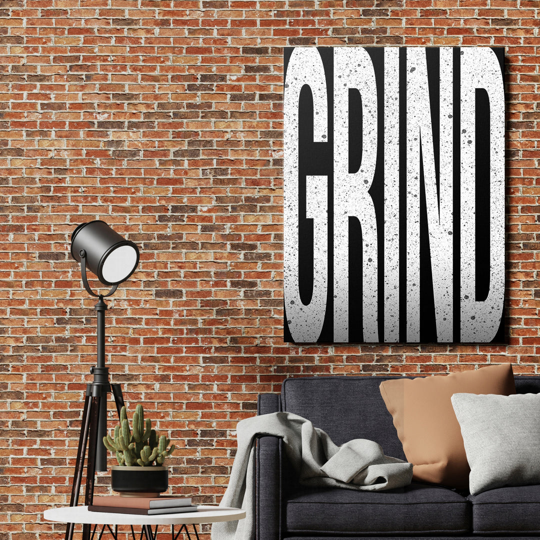 Motivační obraz Grind - Velká písmena na cihlové zdi.