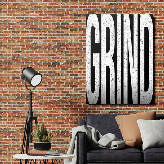 Motivační obraz Grind - Velká písmena na cihlové zdi.