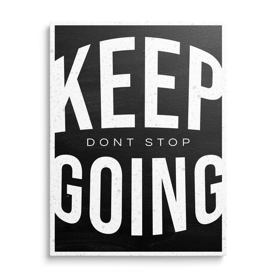 Velká bílá slova Keep a Going s malým nápisem Dont Stop uprostřed, bílý rámeček a opotřebená textura na černém pozadí.