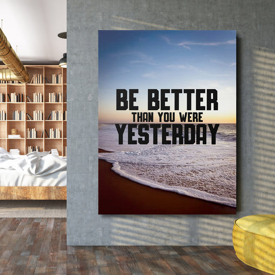 Motivační obraz - Be Better Than Yesterday na velké stěně.