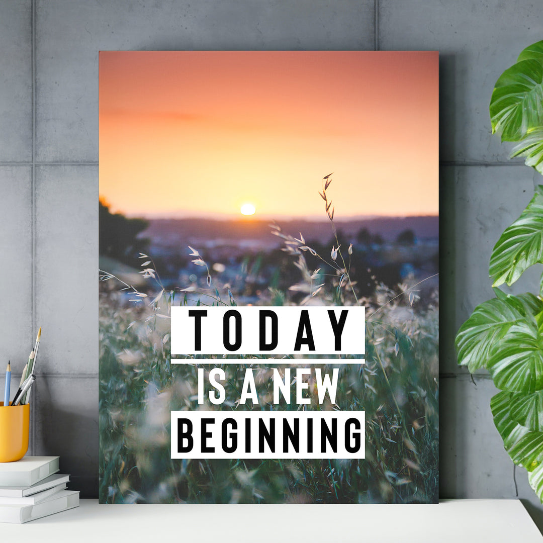 Motivační obraz - Today Is a New Beginning nad pracovním stolem.