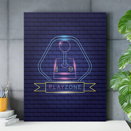 Neonový herní obraz - Playzone a joystick nad pracovním stolem.