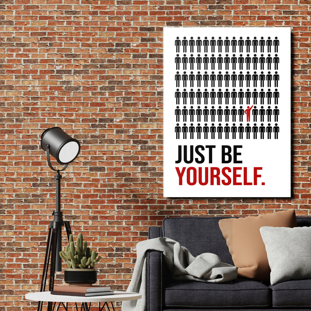 Motivační obraz na zeď v loftovém interiéru s černými piktogramy a jedním červeným u nápisu JUST BE YOURSELF