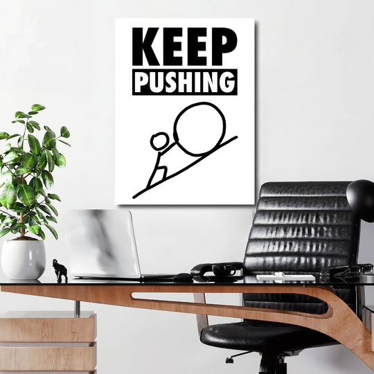 Motivační obraz na plátně do pracovny s černobílou minimalistickou grafikou tlačící postavy a nápisem Keep Pushing