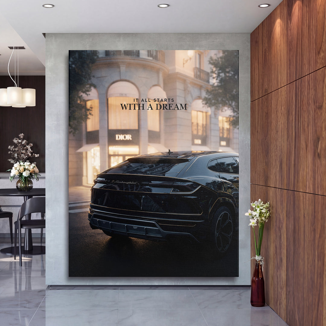 Motivační obraz s černým Lamborghini před butikem Dior a citátem It all starts with a dream v moderní hale