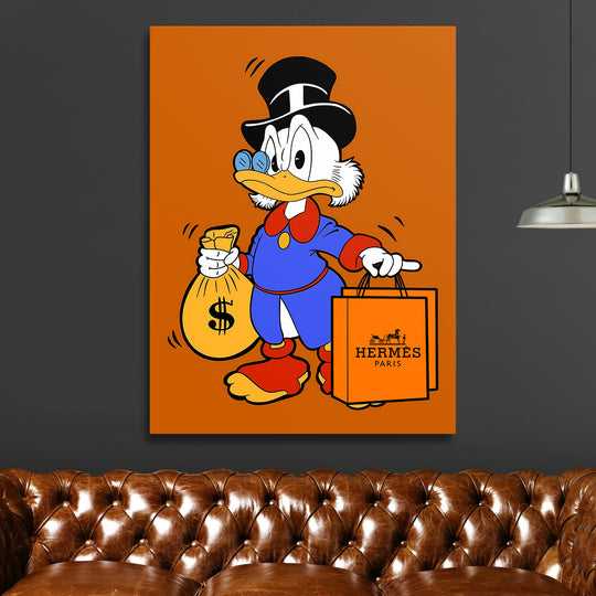 Motivační obraz na plátně s pop art Kačerem Skrblíkem, peněžním sáčkem a luxusní oranžovou taškou Hermès