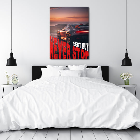 Motivační obraz na plátně se sportovním autem při západu slunce a textem Rest but Never Stop, automotive lifestyle