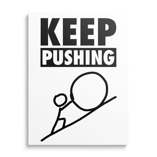 Motivační obraz na plátně s černobílým motivačním citátem KEEP PUSHING a siluetou postavy tlačící velký kámen