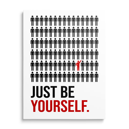 Motivační obraz na plátně zepředu s citátem Just Be Yourself a červenou ikonou mezi černými postavami