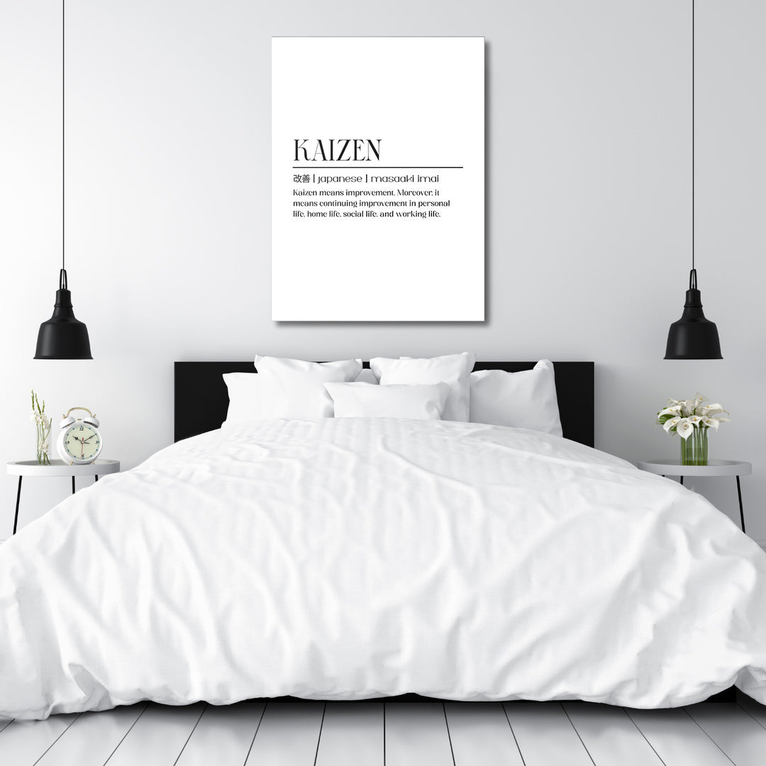 Motivační obraz na plátně s citátem Kaizen nad postelí v moderní minimalistické ložnici