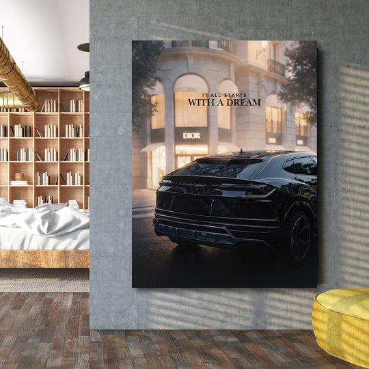 Motivační obraz s černým Lamborghini před luxusní prodejnou a citátem It all starts with a dream v loftovém interiéru