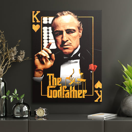Pop art obraz Dona Corleone jako motivační obraz na plátně v pracovně s psacím stolem a pokojovými rostlinami