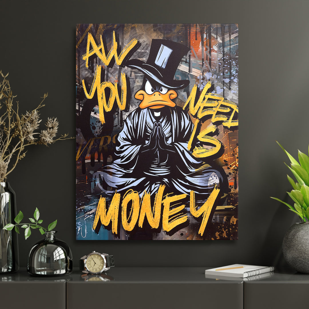 Detail motivačního obrazu černého kačera All You Need Is Money v moderním interiéru.